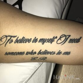 Tattoo Caption :) on the forearm motif: lettering