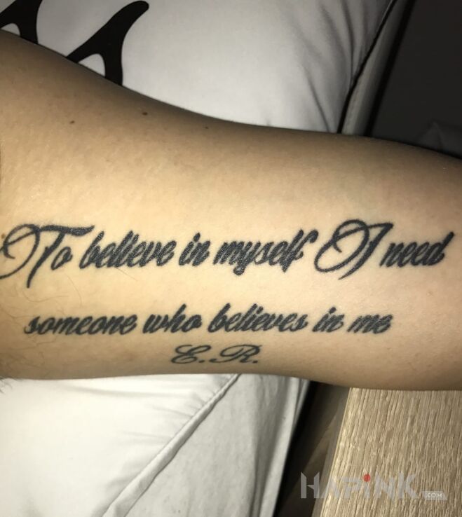 Tattoo Napis :) in lettering motif on the forearm