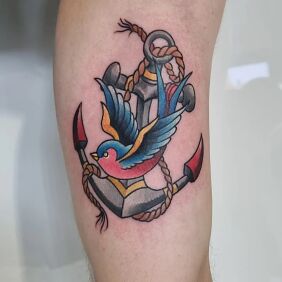 Tattoo Swallow and anchor on the bicep motif: colorful style: neo-traditional