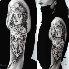 Tattoo Marzanna and Mars on the upper arm motif: black and gray style: graphic / illustrative