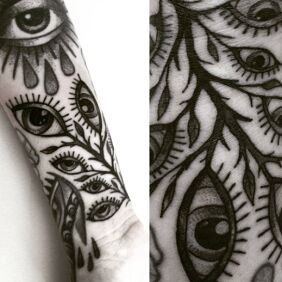 Tattoo Eyes On the arm motif: black and gray style: graphic / illustrative