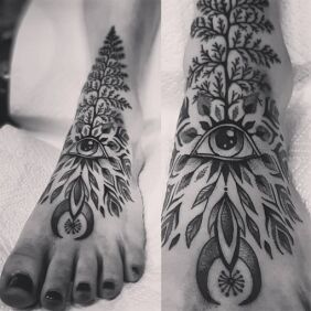 Tattoo Little foot is watching on the leg motif: black and gray style: graphic / illustrative