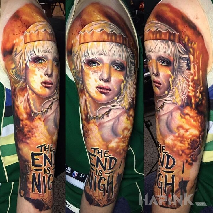 Tattoo The end is nigh in lettering motif and realistic style on the upper arm