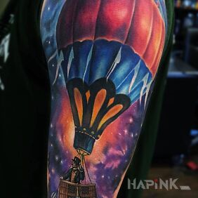 Tattoo Balloon in space on the upper arm motif: cosmos