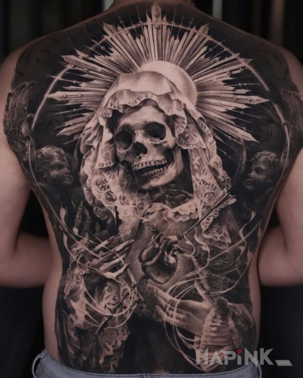 Tattoo Martwa Maryja in religious motif and realistic style on the shoulder blades