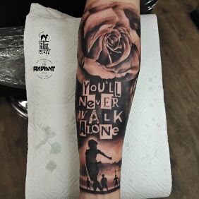 Tattoo You'll never walk alone On the arm motif: black and gray style: realistic
