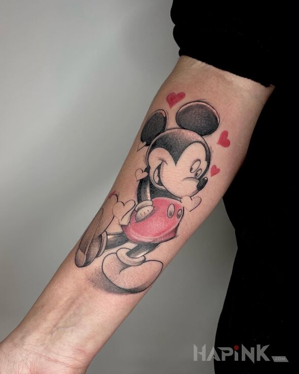 Tattoo Myszka miki in colorful motif and graphic / illustrative style on the forearm
