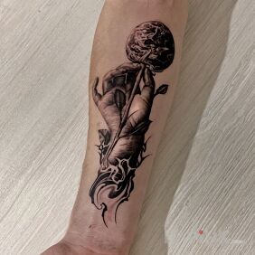 Tattoo World on a stick on the forearm motif: black and gray style: realistic