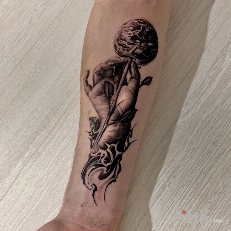 Tattoo Świat na patyku in other motif and realistic style on the forearm