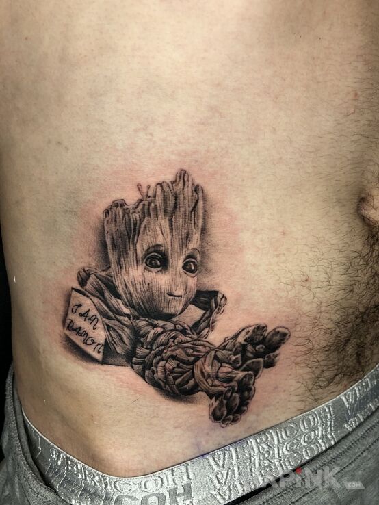 Tattoo Grot in characters motif and realistic style on the stomach