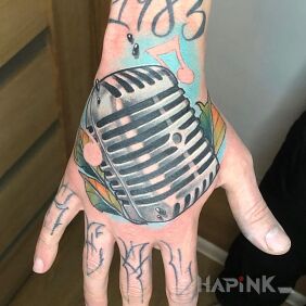 Tattoo Microphone on the hand motif: colorful style: neo-traditional