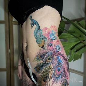 Tattoo Proud as a peacock on the stomach motif: colorful style: realistic