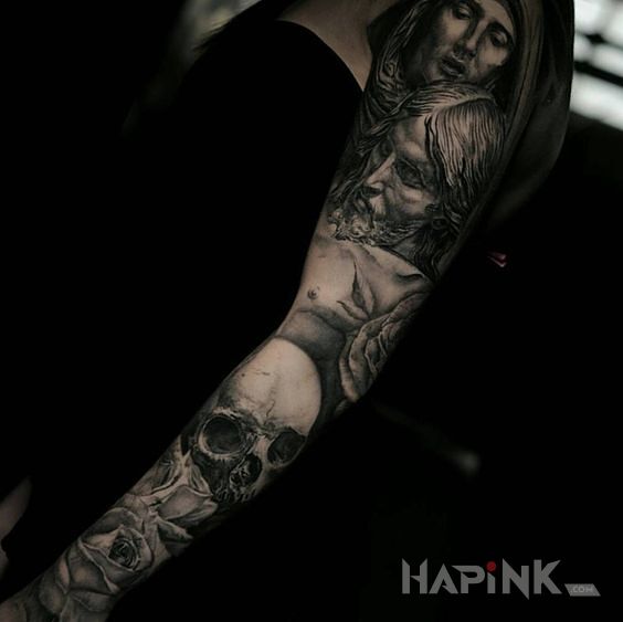 Tattoo Śmierć jezusa in skulls motif and realistic style on the forearm
