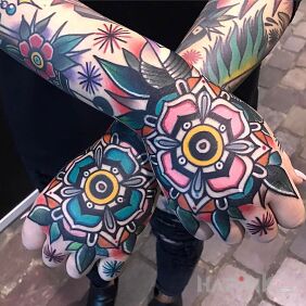 Tattoo Ultra colorful on the forearm motif: flowers