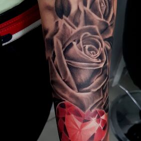 Tattoo Rose paired with a diamond On the arm motif: black and gray style: realistic