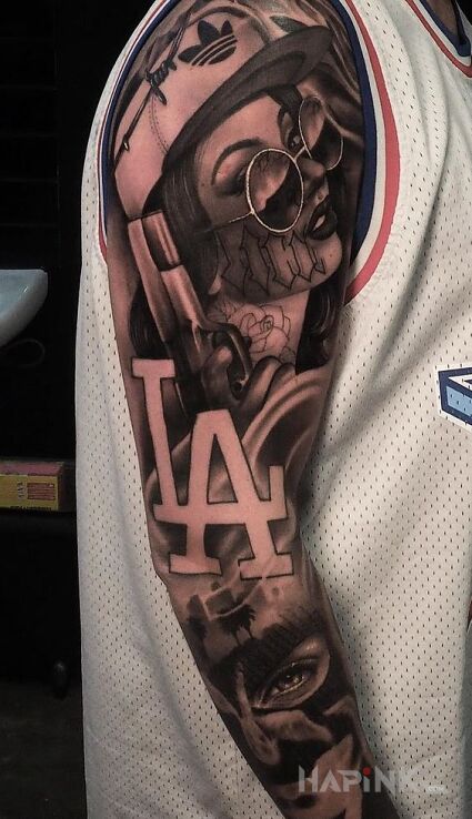 Tattoo Z miasta la in faces motif and realistic style on the forearm