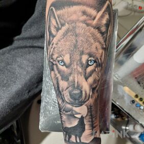 Tattoo Wolf tattoo forearm On the arm motif: black and gray style: realistic