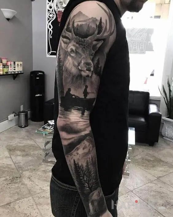 Tattoo O ty jeleniu in nature motif and realistic style on the forearm