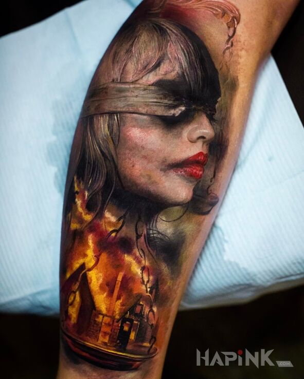 Tattoo Sprawiedliwość in characters motif on the forearm