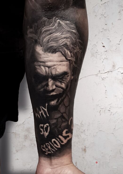 Tattoo Why So Serious? in dark motif and realistic style On the arm