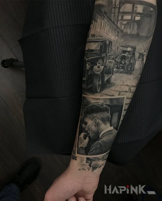 Tattoo Klimat międzywojennych lat in black and gray motif and realistic style on the forearm