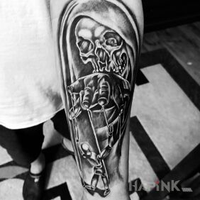 Tattoo Evil Puppet On the arm motif: skulls style: graphic / illustrative