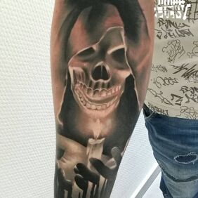 Tattoo Death on the forearm motif: dark style: realistic