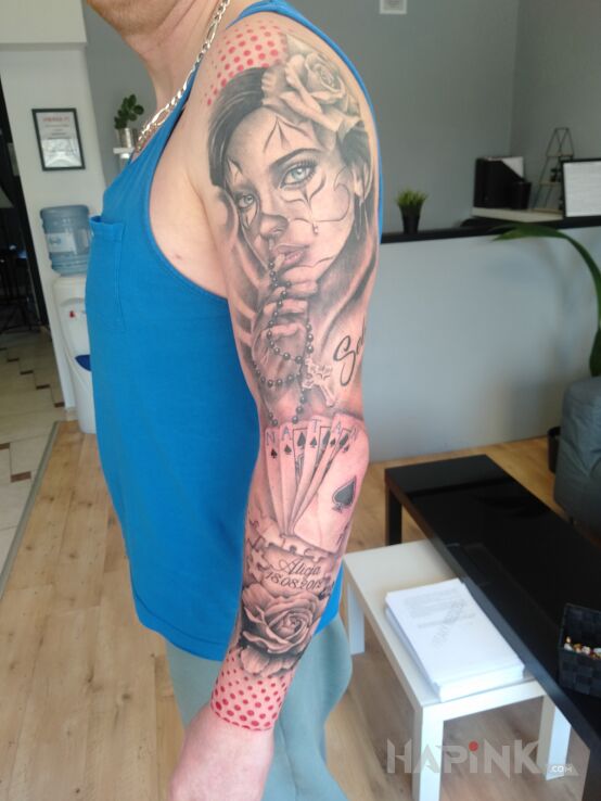 Tattoo Rękaw in faces motif and realistic style On the arm