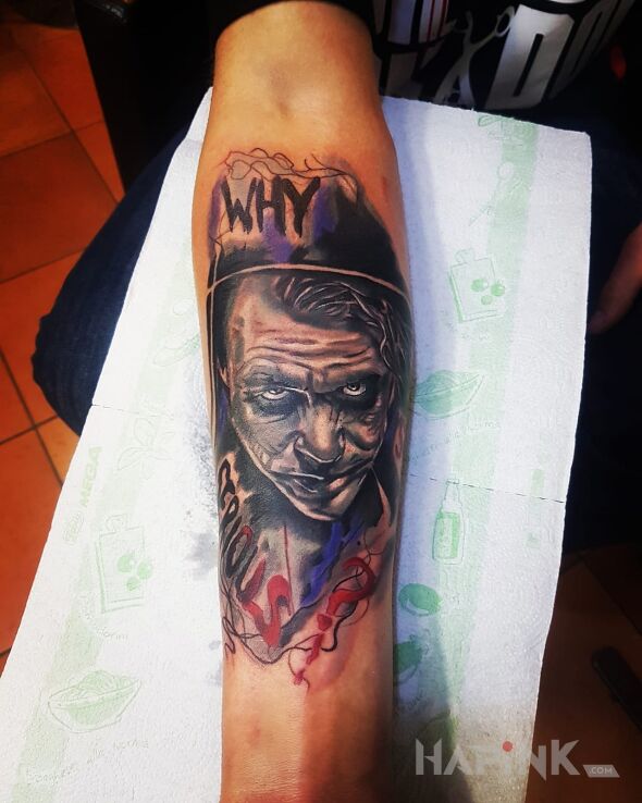 Tattoo Why so serious? in characters motif on the forearm