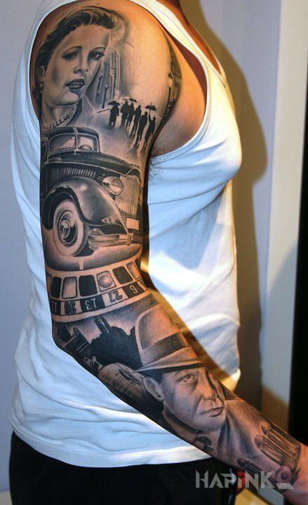 Tattoo Stare auto i ruleta in sleeves motif and realistic style on the upper arm