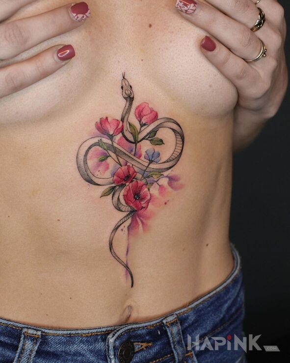 Tattoo Rozmyte kwiatki i wężyk in animals motif and Watercolor style on the stomach