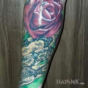 Tattoo Snake in the roses on the forearm motif: animals