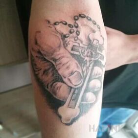 Tattoo Religious Theme on the forearm motif: objects style: realistic