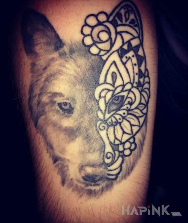 Tattoo Wilk in animals motif on the forearm