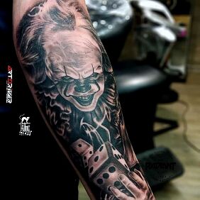 Tattoo Mr Pennywise On the arm motif: dark style: realistic