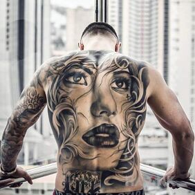 Tattoo Portrait of a girl on the back motif: faces style: realistic