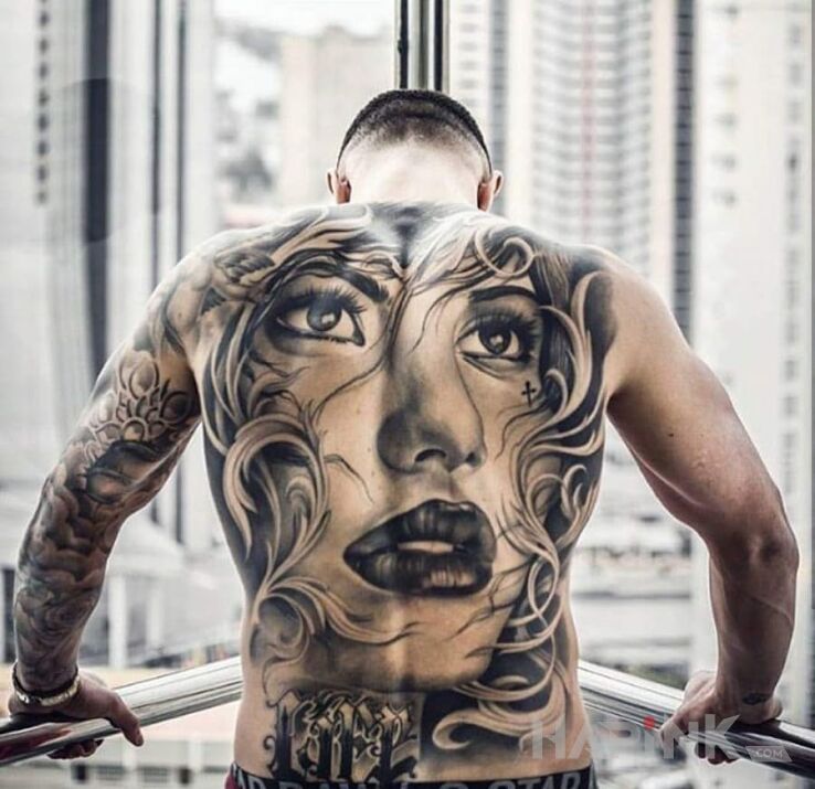 Tattoo Portret dziewczyny in faces motif and realistic style on the back