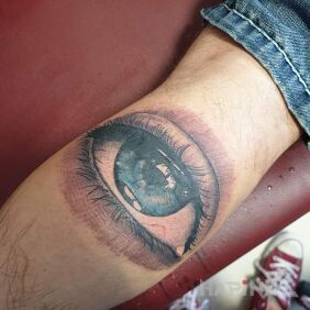 Tattoo Eye on the leg motif: colorful style: realistic