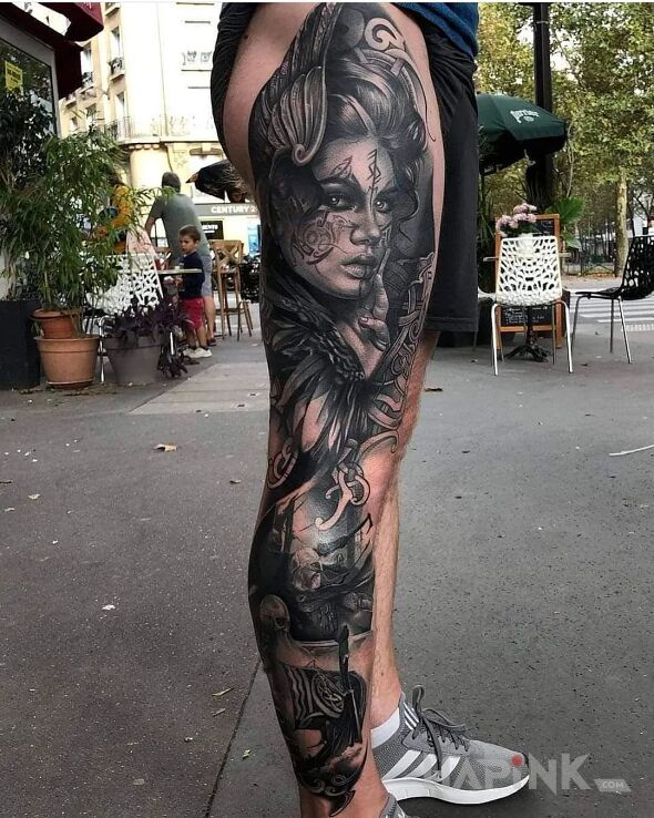 Tattoo Valkyria in black and gray motif and realistic style on the calf