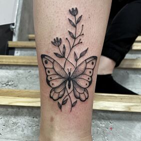 Tattoo Butterfly on the calf motif: black and gray style: graphic / illustrative