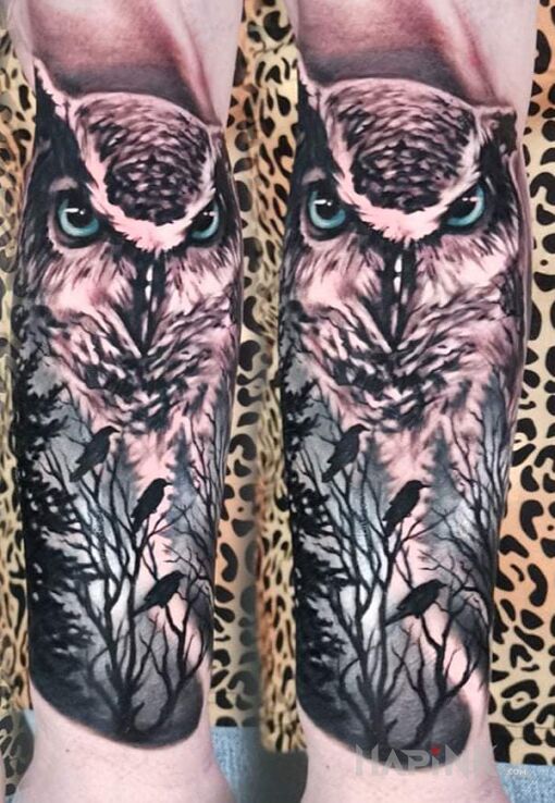 Tattoo Sowa in animals motif and realistic style on the forearm