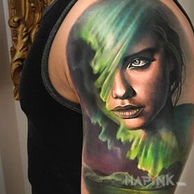 Tattoo Adriana Lima on the upper arm motif: faces style: realistic