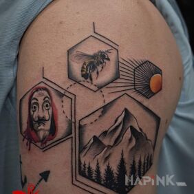Tattoo Mine on the upper arm motif: black and gray style: graphic / illustrative