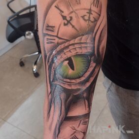 Tattoo Dragon's eye. on the forearm motif: fantasy style: realistic