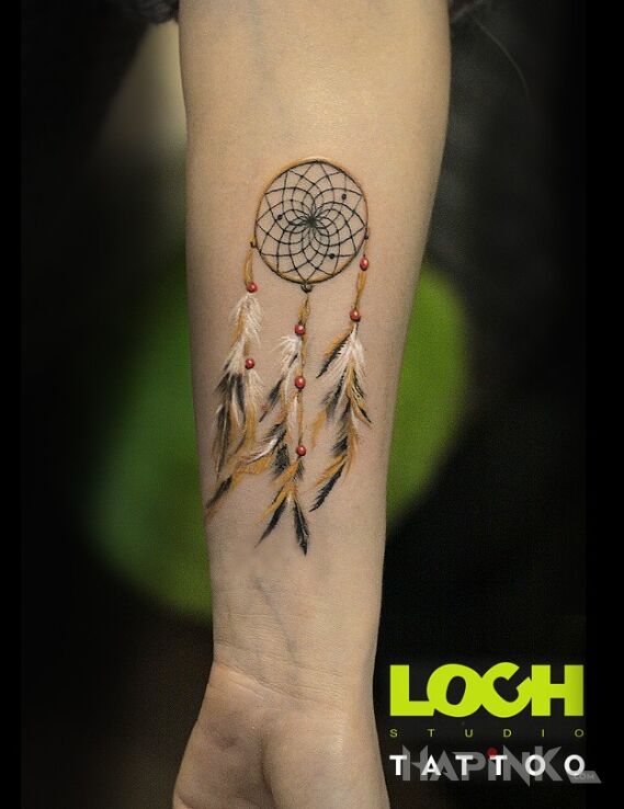 Tattoo Łapacz snów:) in Indian motif and realistic style On the arm