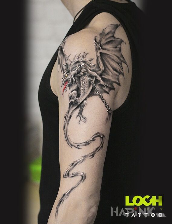 Tattoo Smok in black and gray motif and graphic / illustrative style On the arm