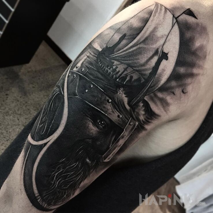 Tattoo Wiking in characters motif and realistic style on the upper arm