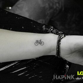 Tattoo MINI BIKE:) on the forearm motif: other style: minimalistic