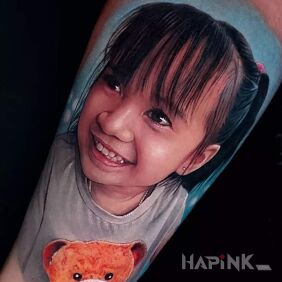Tattoo Amazing portrait of a little girl On the arm motif: 3D style: realistic