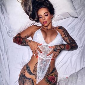 Tattoo Girl in white on the hip motif: faces style: realistic